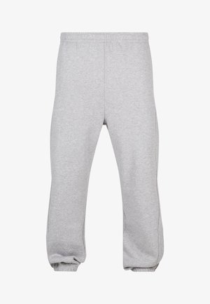 Pantalones de chándal grises hechos de una mezcla de algodón, con cintura elástica, piernas ajustadas y dobladillos acampanados. Diseño simple sin patrones.