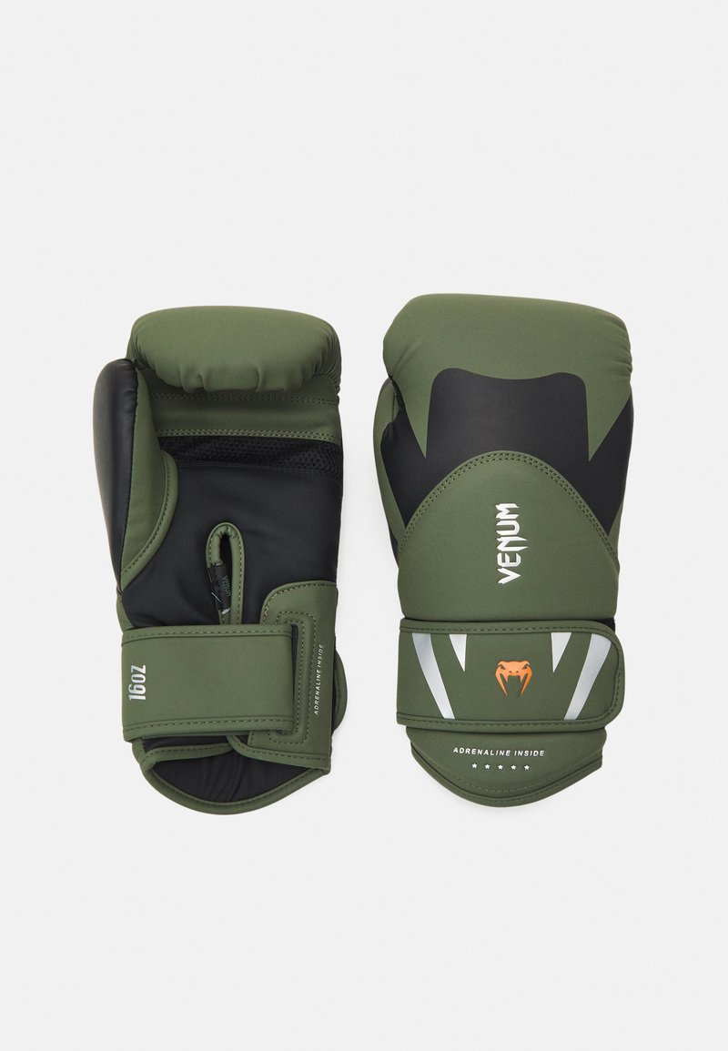Green boxing gloves with black accents, padded design, and adjustable strap. Features logo and graphic details on the exterior.