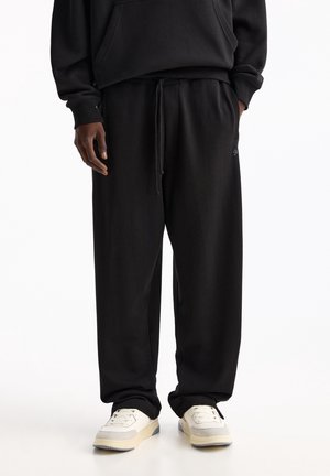 Pantalones deportivos - black