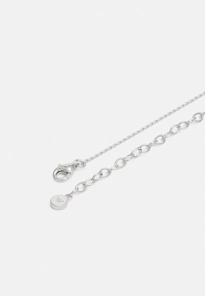 Silver necklace with a mixed chain design, featuring a lobster clasp and a small round charm with engraved logo.