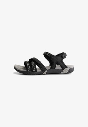 Black and gray open-toe sandal with adjustable straps and textured sole designed for comfort and outdoor use.