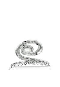 Un accessoire capillaire en argent spiralé avec une grande pierre précieuse centrale, orné de détails complexes et scintillants, sur un fond uni.