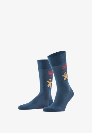 Blaue Baumwollsocken mit einem Grafik eines Lebkuchenmanns, der Sonnenbrillen trägt, und dem Text "TOUGH COOKIE" darüber. Klassisches geripptes Bündchen-Design.