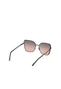 Black metal sunglasses with angular lenses transitioning from light brown to dark brown. Slim black arms with clear silicone nose pads.