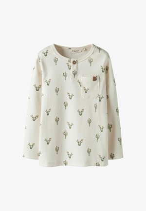 Langärmliges cremefarbenes Hemd mit Kaktusdruck. Hergestellt aus weicher Baumwolle, verfügt es über eine Fronttasche und Holzknopfdetails am Ausschnitt.