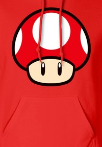 Red hoodie featuring a large graphic of a red mushroom with white spots, black outline, and two small eyes at the bottom.