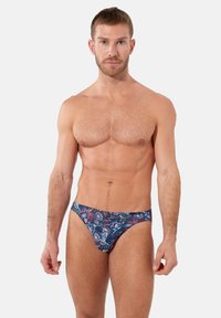 Blaue gemusterte Badehose mit Paisley-Design. Sie verfügt über einen tiefen Schnitt, weichen Stoff und einen elastischen Bund für zusätzlichen Komfort. Minimale Bedeckung.