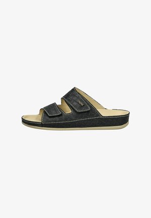 Sandal nero intrecciato con due fasce regolabili in Velcro, suola ammortizzata e cuciture bianche a contrasto lungo i bordi.