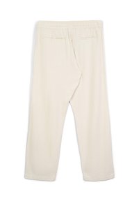 Pantaloni beige, leggeri e dalla vestibilità rilassata con vita elastica, dotati di due tasche posteriori e una texture liscia.