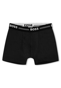 Fekete pamut boxernadrágok puha elasztikus derékpánttal rendelkeznek, amelyen a "BOSS" márkaneve fehér színben látható, a kényelem és a megfelelő illeszkedés érdekében.