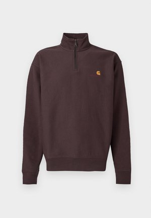 Dunkelbrauner Sweatshirt mit Reißverschluss am Kragen aus weichem Stoff und langen Ärmeln. Verfügt über ein kleines gelb-rotes Logo auf der Brust. Elastische Bündchen und Saum.