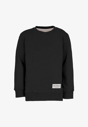 Felpa nera a maniche lunghe con collo a giro, dotata di polsini e orlo a costine, caratterizzata da una piccola etichetta rettangolare bianca vicino all'orlo inferiore.