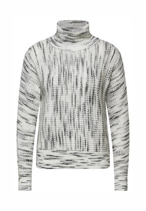 Pull en maille épaisse à col roulé en blanc et noir, avec un motif texturé, des manches longues et des poignets et un ourlet côtelés.