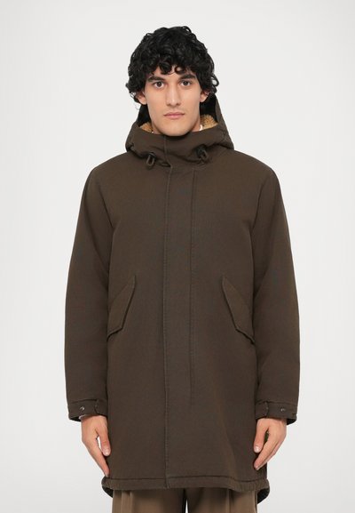 Brown, mid-length parka with a hood, featuring two side pockets, visible stitching, and a lined interior for added warmth.