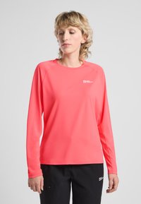 Camicia a maniche lunghe di un vivace rosa, realizzata in tessuto leggero e liscio. Caratterizzata da un collo tondo e maniche raglan. Piccolo logo sul petto.