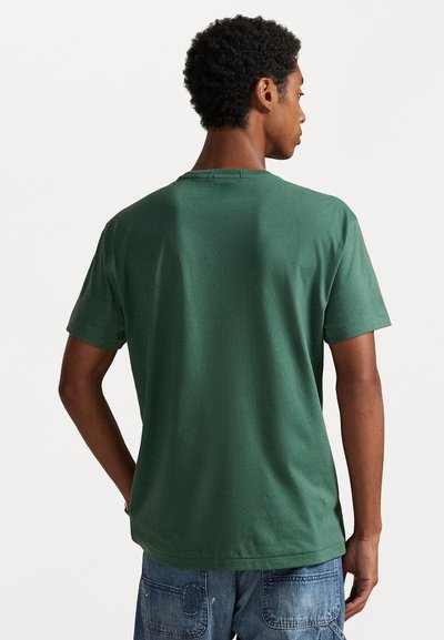 Green cotton t-shirt with short sleeves and a crew neckline, featuring a smooth texture and casual fit. Back view shows plain design.