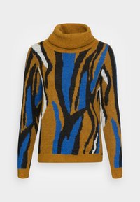 Golf z brązową bazą, ozdobiony wyrazistymi abstrakcyjnymi wzorami w kolorach niebieskim, czarnym i białym. Miękka faktura i luźny krój.