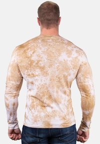 Langarmshirt van een katoenmix, met een koper en witte tie-dye patroon, slanke pasvorm en een ronde halslijn.