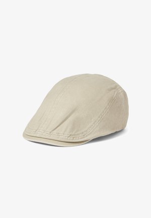 Beige flat cap with visible stitching, made of soft fabric, shown against a white background.