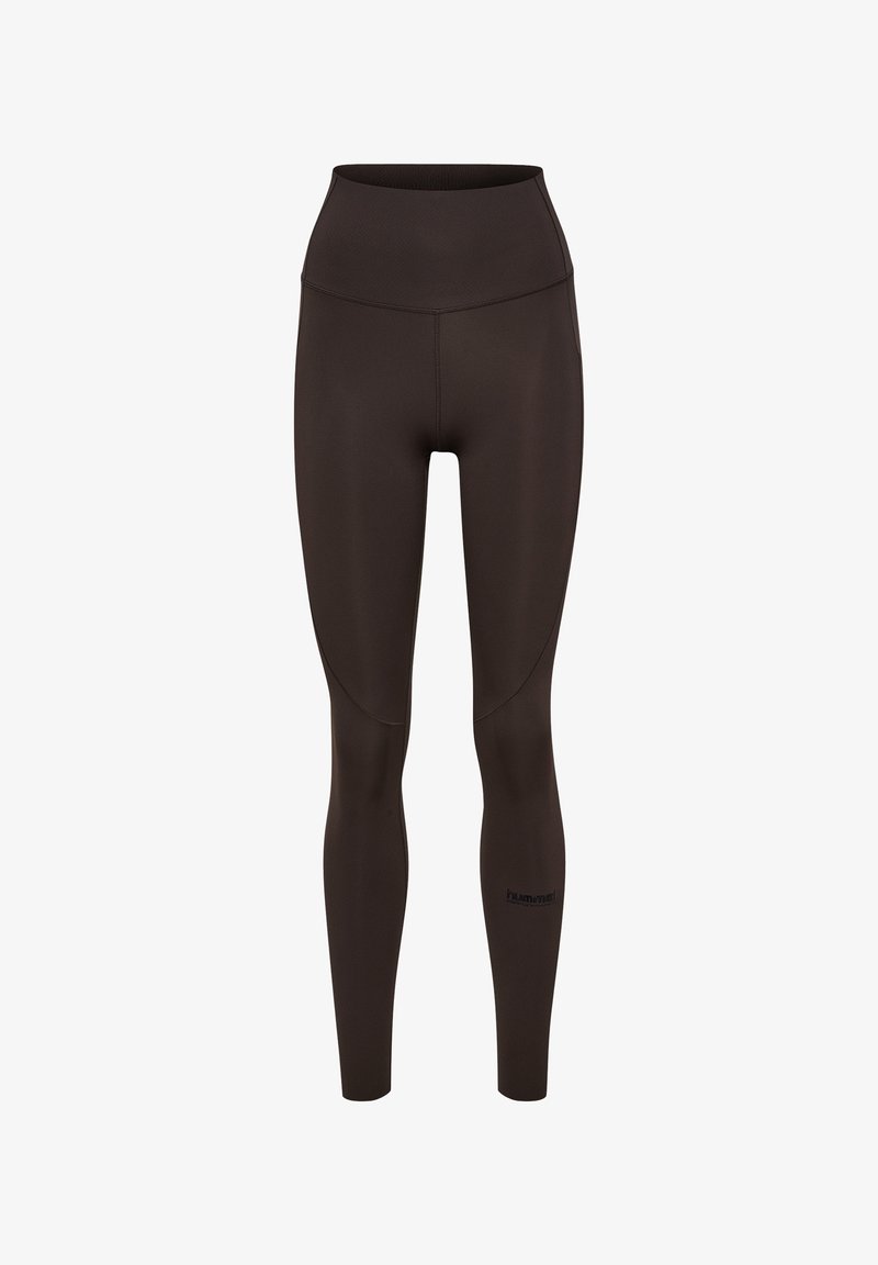 High waist legging in donkerbruin, gemaakt van rekbaar materiaal. Heeft een gladde textuur met gestikte details en een logo bij de enkel.