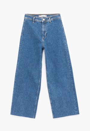Bredde ben blå denimjeans med høj talje, knaplukning og klassisk fem-lomme-design. Har en glat tekstur og ren syning.