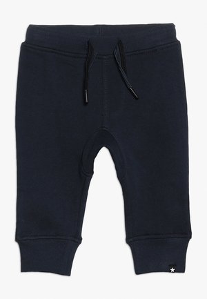 Mørkeblå sweatpants med snøre i taljen, ribbede manchetter og en lille stjerne detalje ved kanten; lavet af blødt, strækbart materiale.