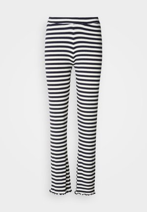 Ribbed striped pants featuring a navy and white pattern, flared hem, and elastic waistband. Texture is smooth with a fitted silhouette.