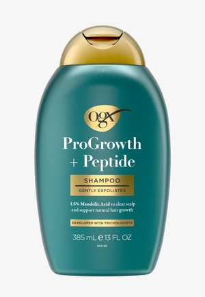 Flacon bleu sarcelle de shampooing OGX ProGrowth + Peptide avec bouchon doré, 385 ml, étiqueté pour exfolier en douceur et favoriser la croissance naturelle des cheveux.