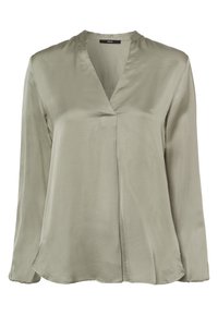 Blouse vert olive en tissu lisse, à encolure en V, manches longues et coupe décontractée avec un ourlet légèrement arrondi.