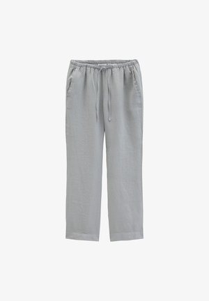 Jasnoszare spodnie o luźnym kroju z elastycznym pasem i sznurkiem, wyposażone w boczne kieszenie i proste nogawki.