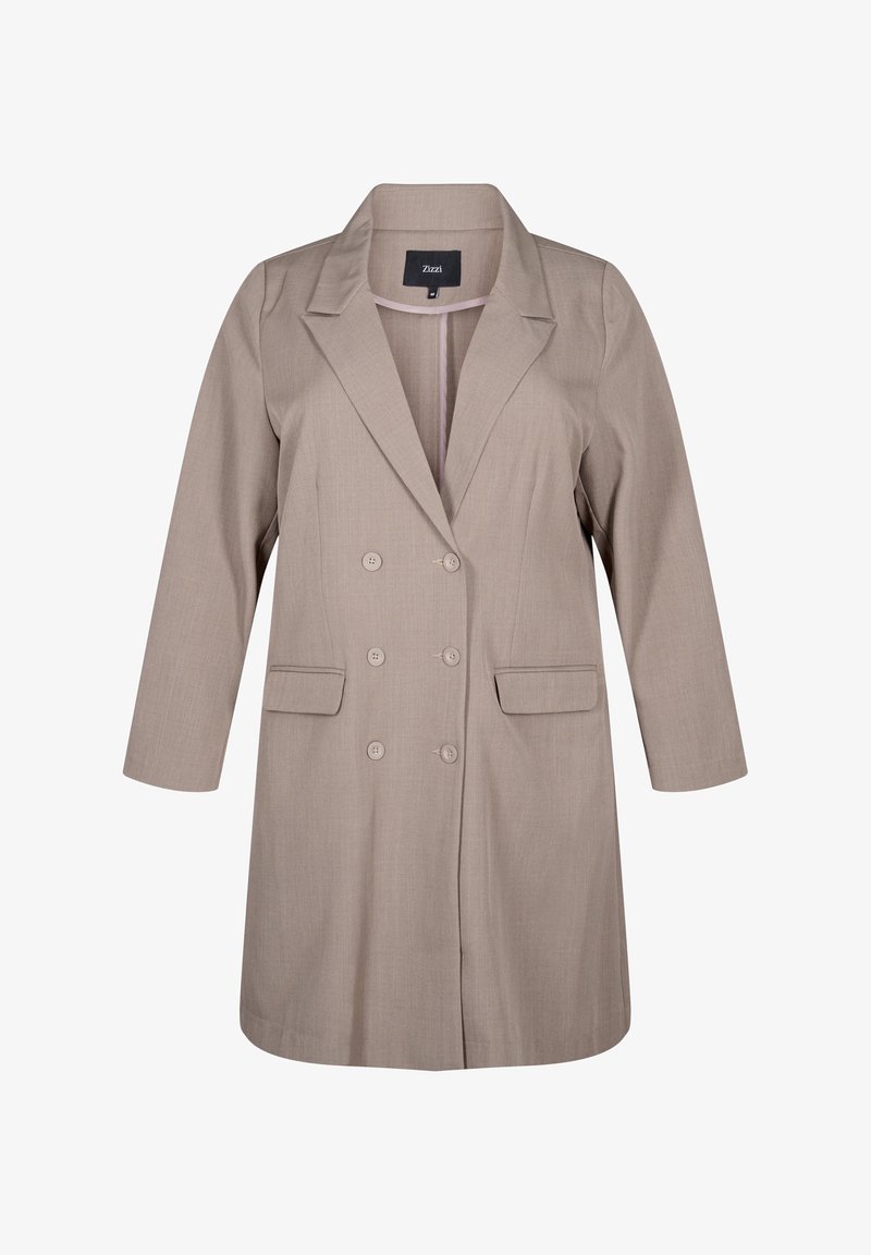 Blazer a medida de color marrón claro con solapa muesca, botones de doble botonadura, dos bolsillos frontales y mangas de longitud media. Tejido texturizado.