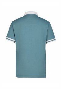 Kortärmad polo i ljusblått med vit krage och ärmstripes. Tillverkad av mjukt, slätt tyg; rak skärning.
