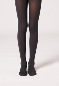 Collant neri opachi con una finitura liscia e opaca. Il design presenta una copertura totale delle gambe e un aspetto semplice e senza cuciture.