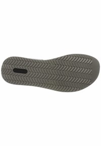 Gray rubber shoe sole with a herringbone tread pattern, featuring a logo in the center and textured surface for grip.