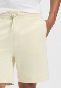 BOSS SEWALK - Pantaloni sportivi - open yellow seventeen