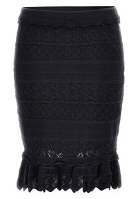 Jupe noire en tricot avec des motifs texturés, silhouette ajustée et ourlet à volants. Présente des motifs en dentelle horizontale et en forme de diamant.