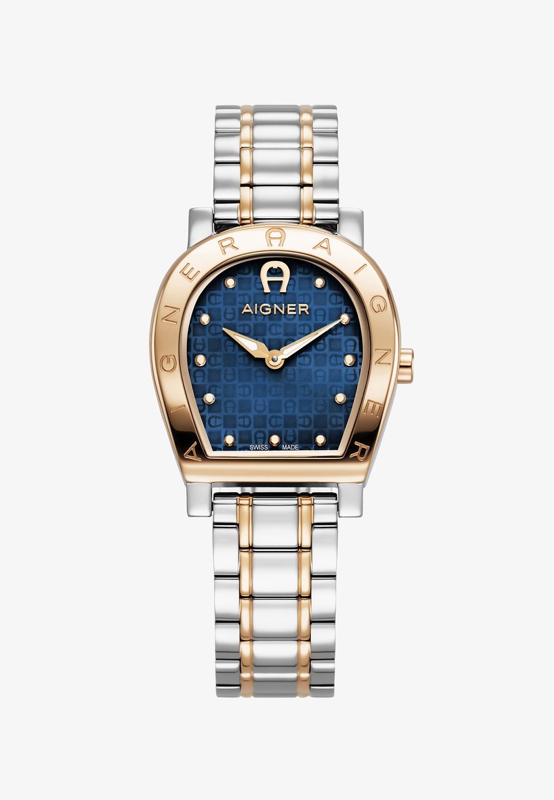 Aigner laikrodis su mėlynu raštuotu ciferblatu, auksu akcentuota rėmeliu ir sidabro bei aukso spalvų metaliniu grandinėle. Yra valandų žymekliai ir rodyklės.
