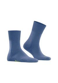 Chaussettes en coton bleues avec des côtes au niveau des chevilles et une texture lisse. Présente un petit logo vert vif dans la zone des orteils.