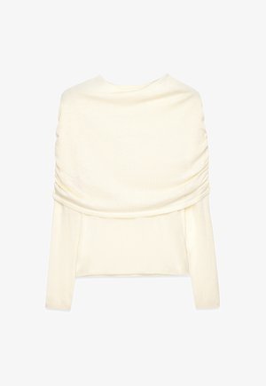 Kreemikaalune pikkade varrukatega tops, laia koonusmütsi kraega, mis langeb õlgadele, valmistatud pehmest kudumiskangast.