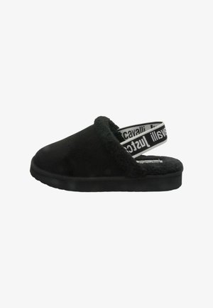 Pantofole nere senza lacci con interno peloso, punta arrotondata, materiale morbido simile alla pelle scamosciata e suola in gomma nera strutturata. Caratterizzate da una fascia con branding.