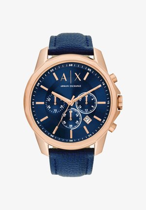 Runde goldfarbene Armani Exchange Uhr mit blauem Zifferblatt, drei Hilfszifferblättern, Datumsfenster bei 4 Uhr und strukturiertem blauen Lederarmband.