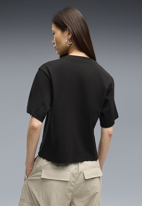 PUMA HER RELAXED T-SHIRT - Basic T-shirt - black — photo 3