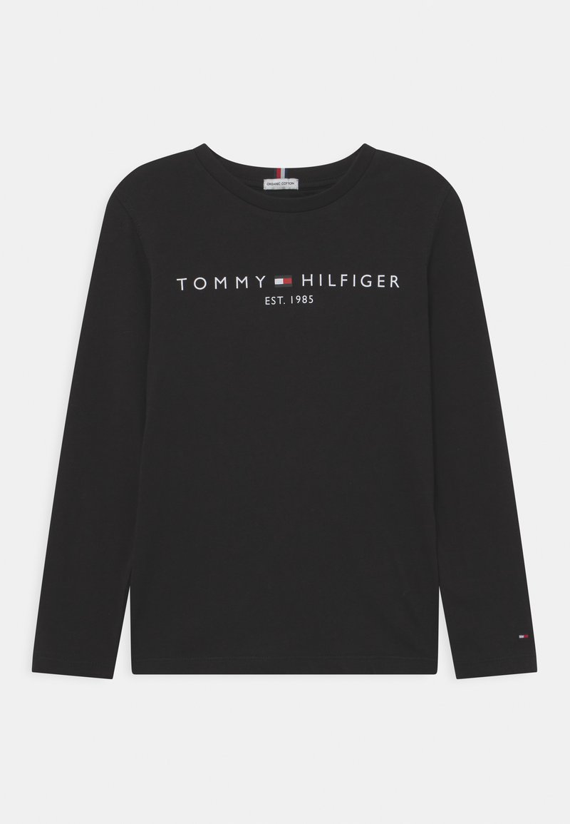 Black long-sleeve t-shirt made of cotton with round neckline. Features "TOMMY HILFIGER" and "EST. 1985" logo in white and red print.