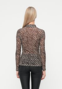 Long-sleeve, sheer top with a leopard print pattern in shades of brown and beige. Features a high neckline and fitted silhouette.