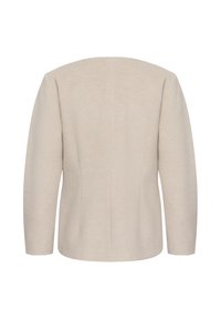 Vue de dos d'une veste simple, à manches longues, beige clair, avec ourlet droit et coutures minimales, présentée sur fond blanc.