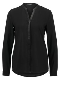 Blusa nera a maniche lunghe realizzata in tessuto liscio, con colletto a scollo a V e patta frontale senza bottoni, con orlo curvo e polsini.