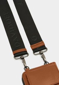 Brown leather pouch with a textured finish, featuring a black strap embossed with "DAVIDOFF" and silver metal hardware.