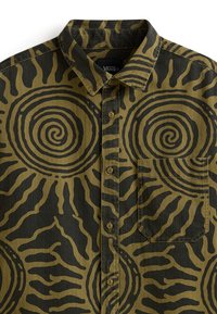 Button-up shirt with olive green and black spiral sunburst pattern, a front chest pocket, and a collar, labeled Vans inside the collar.