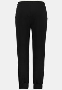Zwarte trainingsbroek met een elastische tailleband en boorden, voorzien van een gladde textuur en een gestroomlijnd ontwerp zonder zichtbare zakken.