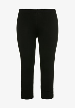 Černé legíny vyrobené z elastického materiálu, s vysokým pasem a úzkým střihem, s hladkým povrchem a bez viditelných vzorů či kovových doplňků.